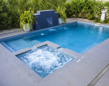 Harkaway bluestone pavers around a pool and garden area.