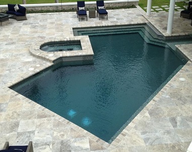 oyster silver travertine tiles around swimming pool by stone pavers melbourne