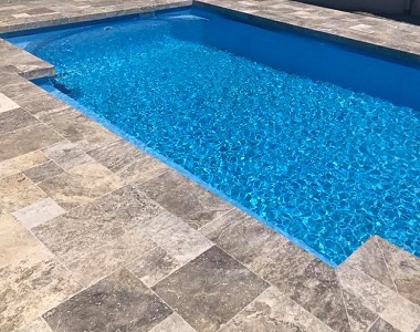 silver travertine pool coping tumbled tiles, silver tiles, silver coping, silver pavers by stone pavers